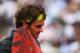 PARIS, FRANCE - JUNE 08: Roger Federer of Switzerland looks dejected in his men's singles semi final match against Novak Djokovic of Serbia during day 13 of the French Open at Roland Garros on June 8, 2012 in Paris, France. (Photo by Clive Brunskill/Getty Images)