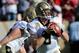 SAN FRANCISCO, CA - JANUARY 14: Drew Brees #9 of the New Orleans Saints looks to pass from the pocket against the San Francisco 49ers in the first quarter of the NFC Divisional playoff game at Candlestick Park on January 14, 2012 in San Francisco, California. (Photo by Thearon W. Henderson/Getty Images)