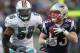 FOXBORO, MA - DECEMBER 24: Wes Welker #83 of the New England Patriots catches a pass despite the defense of Kevin Burnett #56 of the Miami Dolphins in the second half at Gillette Stadium on December 24, 2011 in Foxboro, Massachusetts. (Photo by Jim Rogash/Getty Images)