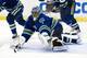 VANCOUVER, CANADA - APRIL 11: Goalie Roberto Luongo #1 of the Vancouver Canucks dives for the loose puck during the first period in Game One of the Western Conference Quarterfinals during the 2012 NHL Stanley Cup Playoffs at Rogers Arena on April 11, 2012 in Vancouver, British Columbia, Canada. (Photo by Rich Lam/Getty Images)