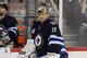 WINNIPEG, CANADA - FEBRUARY 27: Ondrej Pavelec #31 of the Winnipeg Jets looks on during a break in play as Chris Mason #50 sits on the bench during a game against the Edmonton Oilers in NHL action at the MTS Centre on February 27, 2012 in Winnipeg, Manitoba, Canada. (Photo by Marianne Helm/Getty Images)