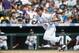 DENVER, CO - JUNE 10: Carlos Gonzalez #5 of the Colorado Rockies bunts for a single in the seventh inning of an interleague game against the Los Angeles Angels of Anaheim at Coors Field on June 10, 2012 in Denver, Colorado. The Angels defeated the Rockies 10-8. (Photo by Dustin Bradford/Getty Images)