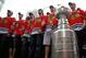 CHICAGO - JUNE 11: Members of the Chicago Blackhawks stand with the Stanley Cup during the Chicago Blackhawks Stanley Cup victory parade and rally on June 11, 2010 in Chicago, Illinois. (Photo by Jonathan Daniel/Getty Images)