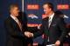 ENGLEWOOD, CO - MARCH 20: Quarterback Peyton Manning (R) shakes hands with executive vice president of football operations John Elway during a news conference announcing Manning's contract with the Denver Broncos in the team meeting room at the Paul D. Bowlen Memorial Broncos Centre on March 20, 2012 in Englewood, Colorado. Manning, entering his 15th NFL season, was released by the Indianapolis Colts on March 7, 2012, where he had played his whole career. It has been reported that Manning will sign a five-year, $96 million offer. (Photo by Justin Edmonds/Getty Images)