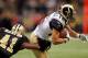 NEW ORLEANS, LA - DECEMBER 12: Danny Amendola #16 of the St. Louis Rams is tackled by Roman Harper #41 of the New Orleans Saints at the Louisiana Superdome on December 12, 2010 in New Orleans, Louisiana. The Saints defeated the Rams 31-13. (Photo by Chris Graythen/Getty Images)