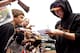 Tim Lincecum signs autographs for fans in Seattle prior to losing his sixth straight game.