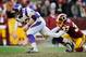 LANDOVER, MD - DECEMBER 24: Toby Gerhart #32 of the Minnesota Vikings breaks the tackle of Reed Doughty #37 of the Washington Redskins during a game at FedExField on December 24, 2011 in Landover, Maryland. (Photo by Patrick McDermott/Getty Images)