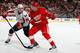 DETROIT - OCTOBER 10: Justin Abdelkader #8 of the Detroit Red Wings skates against Tyler Sloan #89 of the Washington Capitals on October 10, 2009 at Joe Louis Arena in Detroit, Michigan. (Photo by Gregory Shamus/Getty Images)