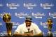 MIAMI, FL - JUNE 21: LeBron James #6 of the Miami Heat answers questions from the media next to the Larry O'Brien Finals Championship trophy and James' Bill Russell Finals MVP trophy during his post game press conference after they won 121-106 against the Oklahoma City Thunder in Game Five of the 2012 NBA Finals on June 21, 2012 at American Airlines Arena in Miami, Florida. NOTE TO USER: User expressly acknowledges and agrees that, by downloading and or using this photograph, User is consenting to the terms and conditions of the Getty Images License Agreement. (Photo by Ronald Martinez/Getty Images)