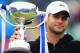 EASTBOURNE, ENGLAND - JUNE 23: Andy Roddick of USA holds aloft the winner's trophy after defeating Andreas Seppi of Italy in the Men's Final during the AEGON International at Devonshire Park on June 23, 2012 in Eastbourne, England. (Photo by Mike Hewitt/Getty Images)