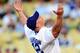LOS ANGELES, CA - AUGUST 20: WWE Superstar John Cena throws the ceremonial first pitch for the Los Angeles Dodgers as they play the Chicago Cubs on August 20, 2009 at Dodger Stadium in Los Angeles, California. (Photo by Jacob de Golish/Getty Images)