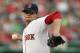 BOSTON, MA - JUNE 19: Clay Buchholz #11 of the Boston Red Sox throws against the Miami Marlins in the first inning during interleague play at Fenway Park June 19, 2012 in Boston, Massachusetts. (Photo by Jim Rogash/Getty Images)