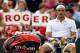 LONDON, ENGLAND - JUNE 25: Roger Federer of Switzerland takes a break during his mens singles first round match against Albert Ramos of Spain on day one of the Wimbledon Lawn Tennis Championships at the All England Lawn Tennis and Croquet Club on June 25, 2012 in London, England. (Photo by Paul Gilham/Getty Images)