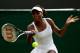 LONDON, ENGLAND - JUNE 25: Venus Williams of USA returns the ball during her womens singles first round match against Elena Vesnina of Russia on day one of the Wimbledon Lawn Tennis Championships at the All England Lawn Tennis and Croquet Club on June 25, 2012 in London, England. (Photo by Clive Rose/Getty Images)