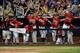 OMAHA, NE - JUNE 24: The Arizona Wildcats dugout celebrate the run of Robert Refsnyder #2 for a 5-1 lead over South Carolina Gamecocks in the seventh inning during game 1 of the College World Series at TD Ameritrade Field on June 24, 2012 in Omaha, Nebraska. (Photo by Harry How/Getty Images)