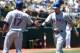 OAKLAND, CA - JUNE 07: Josh Hamilton #32 of the Texas Rangers after scoring on an RBI single from Adrian Beltre #29 is congratulated by Nelson Cruz #17 in the fourth inning against the Oakland Athletics at O.co Coliseum on June 7, 2012 in Oakland, California. (Photo by Thearon W. Henderson/Getty Images)