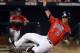 OMAHA, NE - JUNE 24: Robert Refsnyder #2 of the Arizona Wildcats slides in for a run and a 5-1 lead over the South Carolina Gamecocks in the seventh inning during game 1 of the College World Series at TD Ameritrade Field on June 24, 2012 in Omaha, Nebraska. (Photo by Harry How/Getty Images)
