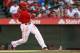 ANAHEIM, CA - JUNE 23: Erick Aybar #2 of the Los Angeles Angels of Anaheim hits a RBI single to shortstop against the Los Angeles Dodgers to drive in the first Angels run in the fifth inning at Angel Stadium of Anaheim on June 23, 2012 in Anaheim, California. (Photo by Jeff Golden/Getty Images)
