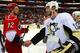 Eric Staal (left) and Jordan Staal (right) shake hands after the game.