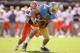 SAN FRANCISCO, CA - DECEMBER 31: Ian Thomas #38 of the Illinois Fighting Illini tackles Joseph Fauria #8 of the UCLA Bruins during the Kraft Fight Hunger Bowl at AT&T Park on December 31, 2011 in San Francisco, California. (Photo by Ezra Shaw/Getty Images)