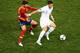 DONETSK, UKRAINE - JUNE 23: Gerard Pique of Spain and Olivier Giroud of France challenge for the ball during the UEFA EURO 2012 quarter final match between Spain and France at Donbass Arena on June 23, 2012 in Donetsk, Ukraine. (Photo by Jasper Juinen/Getty Images)