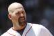 BOSTON, MA - JUNE 24: Kevin Youkilis #20 of the Boston Red Sox looks on between innings of the interleague game against the Atlanta Braves at Fenway Park on June 23, 2012 in Boston, Massachusetts. (Photo by Winslow Townson/Getty Images)