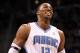 ORLANDO, FL - MARCH 13: Dwight Howard #12 of the Orlando Magic smiles during the game against the Miami Heat at Amway Center on March 13, 2012 in Orlando, Florida. NOTE TO USER: User expressly acknowledges and agrees that, by downloading and or using this photograph, User is consenting to the terms and conditions of the Getty Images License Agreement. (Photo by Sam Greenwood/Getty Images)