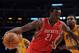 LOS ANGELES, CA - APRIL 06: Samuel Dalembert #21 of the Houston Rockets dribbles to the basket in front of Andrew Bynum #17 of the Los Angeles Lakers at Staples Center on April 6, 2012 in Los Angeles, California. NOTE TO USER: User expressly acknowledges and agrees that, by downloading and or using this photograph, User is consenting to the terms and conditions of the Getty Images License Agreement. (Photo by Harry How/Getty Images)
