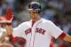 BOSTON, MA - JUNE 24: Cody Ross #7 of the Boston Red Sox is greeted at the dugout during the fourth inning of the interleague game against the Atlanta Braves at Fenway Park on June 24, 2012 in Boston, Massachusetts. (Photo by Winslow Townson/Getty Images)
