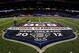 NEW ORLEANS, LA - JANUARY 08: Grounds crew workers paint the Allstate BCS Championship logo on the field at the Mercedes-Benz Superdome on January 8, 2012 in New Orleans, Louisiana. (Photo by Michael Heiman/Getty Images)