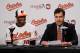 BALTIMORE, MD - MAY 27: Adam Jones #10 of the Baltimore Orioles smiles while addressing the media with Dan Duquette, executive vice president of baseball operations for the team after announcing Jones had signed a six-year contract through the 2018 season before the start of the Orioles game against the Kansas City Royals at Oriole Park at Camden Yards on May 27, 2012 in Baltimore, Maryland. (Photo by Rob Carr/Getty Images)