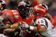 NEW ORLEANS, LA - DECEMBER 17: Alonzo Harris #46 of the Louisiana-Lafayette Ragin Cajuns avoids a tackle by J.J. Autele #49 of the San Diego State Aztecs during the R&L Carriers New Orleans Bowl at Mercedes-Benz Superdome on December 17, 2011 in New Orleans, Louisiana. (Photo by Chris Graythen/Getty Images)