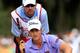 Webb Simpson reads putt at Children's Mracle Network