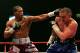 NEWCASTLE, UNITED KINGDOM - MARCH 30: Colin McNeil (R) of the UK fights against Cornelius Bundrage of the U.S. during the Contender Challenge Light-Middleweight match between the UK and USA at the Metro Radio Arena March 30, 2007 in Newcastle, England. (Photo by Matthew Lewis/Getty Images)
