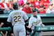 Manager Bob Melvis congratulates Chris Carter after his home run