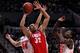 PORTLAND, OR - MARCH 17: Drew Gordon #32 of the New Mexico Lobos goes up for a shot between Kyle Kuric #14 and Gorgui Dieng #10 of the Louisville Cardinals in the first half during the third round of the 2012 NCAA Men's Basketball Tournament at the Rose Garden Arena on March 17, 2012 in Portland, Oregon. (Photo by Jonathan Ferrey/Getty Images)