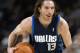DENVER - DECEMBER 18: Steve Nash #13 of the Dallas Mavericks holds the ball during the game against the Denver Nuggets at Pepsi Center on December 18, 2002 in Denver, Colorado. The Mavs won 80-75. NOTE TO USER: User expressly acknowledges and agrees that, by downloading and/or using this Photograph, User is consenting to the terms and conditions of the Getty Images License Agreement. (Photo by Brian Bahr/Getty Images)