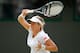 LONDON, ENGLAND - JUNE 29: Kim Clijsters of Belgium returns the ball during her Ladies' singles third round match against Vera Zvonareva of Russia on day five of the Wimbledon Lawn Tennis Championships at the All England Lawn Tennis and Croquet Club on June 29, 2012 in London, England. (Photo by Paul Gilham/Getty Images)