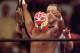SAN DIEGO - JULY 12: New cruiserweight champion Rey Mysterio Jr acknowledges the crowd after defeating Jericho during the WWE Bash at the Beach event at Cox Arena in San Diego, California on July 12, 1998. (Photo by Elsa /Getty Images)