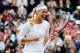 LONDON, ENGLAND - JULY 02: Sabine Lisicki of Germany celebrates after her Ladies' singles fourth round match against Maria Sharapova of Russia on day seven of the Wimbledon Lawn Tennis Championships at the All England Lawn Tennis and Croquet Club on July 2, 2012 in London, England. (Photo by Paul Gilham/Getty Images)
