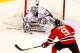 NEWARK, NJ - JUNE 02: Jonathan Quick #32 of the Los Angeles Kings makes a save as Zach Parise #9 of the New Jersey Devils looks on during Game Two of the 2012 NHL Stanley Cup Final at the Prudential Center on June 2, 2012 in Newark, New Jersey. (Photo by Paul Bereswill/Getty Images)