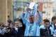 MANCHESTER, ENGLAND - MAY 14: Roberto Mancini the manager of Manchester City stands alongside his captain, Vincent Kompany (C) and Samir Nasri (R) as they parade the Barclays Premier League trophy in front of thousands of fans during their victory parade around the streets of Manchester on May 14, 2012 in Manchester, England. (Photo by Christopher Furlong/Getty Images)