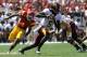 LOS ANGELES, CA - SEPTEMBER 03: Quarterback MarQueis Gray #5 of the Minnesota Golden Gophers rolls out with the ball against the USC Trojans at the Los Angeles Memorial Coliseum on September 3, 2011 in Los Angeles, California. USC won 19-17. (Photo by Stephen Dunn/Getty Images)