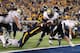 MORGANTOWN, WV - NOVEMBER 25: Isaac Bennett #34 of the University of Pittsburgh Panthers runs in for a touchdown in the first half against the West Virginia Mountaineers during the 2011 Backyard Brawl on November 25, 2011 at Mountaineer Field in Morgantown, West Virginia. (Photo by Jared Wickerham/Getty Images)