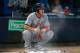 ATLANTA, GA - JUNE 29: Bryce Harper #34 of the Washington Nationals squats in a cloud of rosin he put on his hands and arms prior to batting against the Atlanta Braves at Turner Field on June 29, 2012 in Atlanta, Georgia. (Photo by Kevin C. Cox/Getty Images)