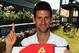 LONDON, ENGLAND - JULY 04: (EXCLUSIVE COVERAGE) Novak Djokovic of Serbia poses with a cake decorated in the colours of the Serbian flag as he celebrates becoming the new World number one tennis player on July 4, 2011 in London, England. (Photo by Clive Brunskill/Getty Images)