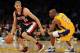 LOS ANGELES, CA - FEBRUARY 20: Nicolas Batum #88 of the Portland Trail Blazers dribbles past Kobe Bryant #24 of the Los Angeles Lakers during the game at Staples Center on February 20, 2012 in Los Angeles, California. NOTE TO USER: User expressly acknowledges and agrees that, by downloading and or using this photograph, User is consenting to the terms and conditions of the Getty Images License Agreement. (Photo by Harry How/Getty Images)