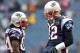 FOXBORO, MA - JANUARY 22: Tom Brady #12 of the New England Patriots talks with teammate Deion Branch #84 on the field prior to their AFC Championship Game against the Baltimore Ravens at Gillette Stadium on January 22, 2012 in Foxboro, Massachusetts. (Photo by Jim Rogash/Getty Images)
