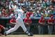 DENVER, CO - JUNE 10: Carlos Gonzalez #5 of the Colorado Rockies hits a home run during the second inning of a game against the Los Angeles Angels of Anaheim at Coors Field on June 10, 2012 in Denver, Colorado. The Angels defeated the Rockies 10-8. (Photo by Dustin Bradford/Getty Images)
