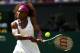 LONDON, ENGLAND - JULY 05: Serena Williams of the USA returns a shot during her Ladies' Singles semi final match against Victoria Azarenka of Belarus on day ten of the Wimbledon Lawn Tennis Championships at the All England Lawn Tennis and Croquet Club on July 5, 2012 in London, England. (Photo by Clive Brunskill/Getty Images)